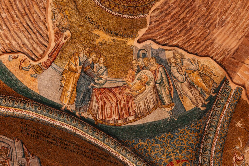 Detailed view of a Byzantine mosaic in a church depicting historical religious scenes.